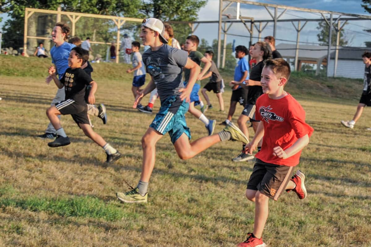 Boys running at summer camp