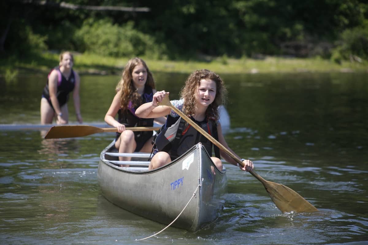 Girls on a canoe at Brown Ledge
